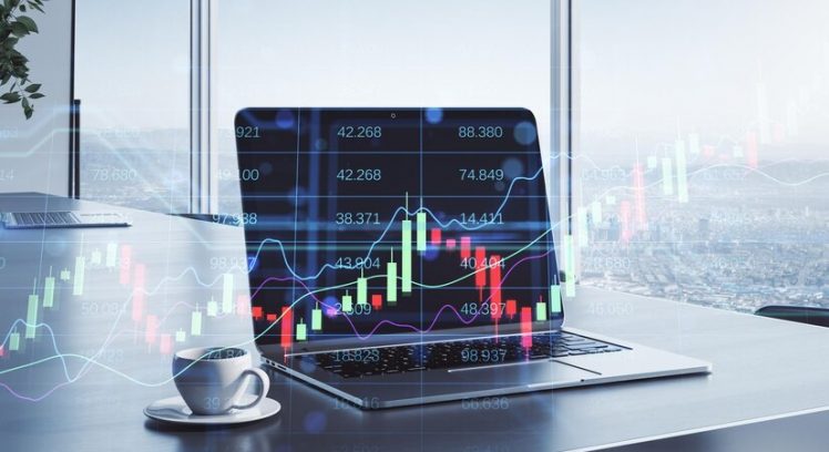 business-financial-report-concept-with-digital-financial-chart-growing-candlestick-graphs-modern-laptop-stylish-office-background-double-exposure_670147-27137