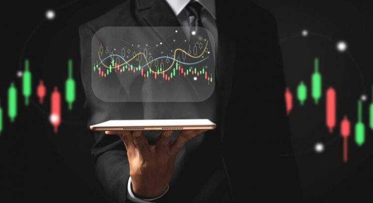 business-man-holding-tablet-showing-holographic-graphs-stock-market-statistics-gain-profits_86639-1682