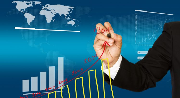 Businessman hand write business graph