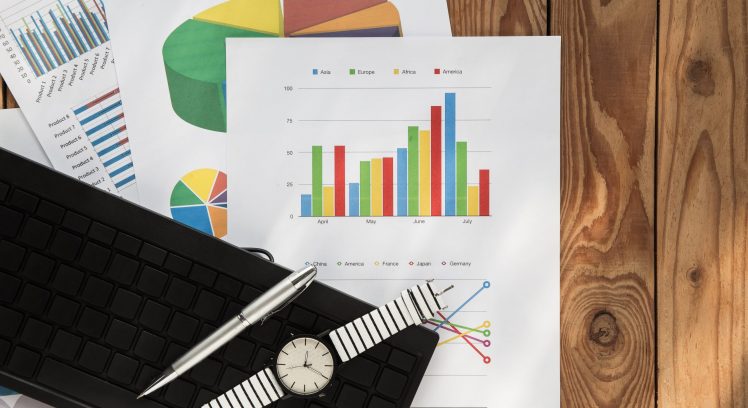 Flat lay business chart on wood background