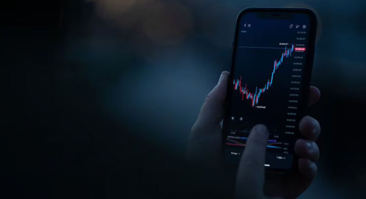 investing-online-male-hand-monitoring-stock-exchange-data-smartphone-using-investment-app-analyzing-price-activity-real-time-selective-focus-mobile-phone-with-financial-chart-screen_95891-4085