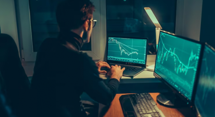 nighttime-analysis-guy-typing-laptop-home-office_184353-2958