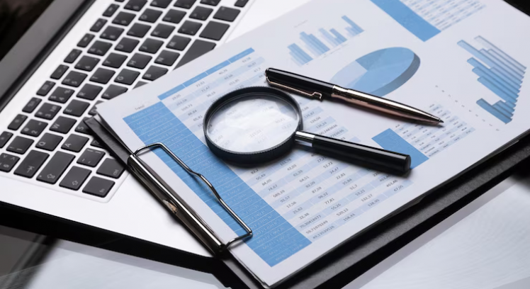 office-workplace-with-magnifier-stationery_88135-67