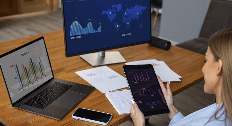 person-looking-finance-graphs