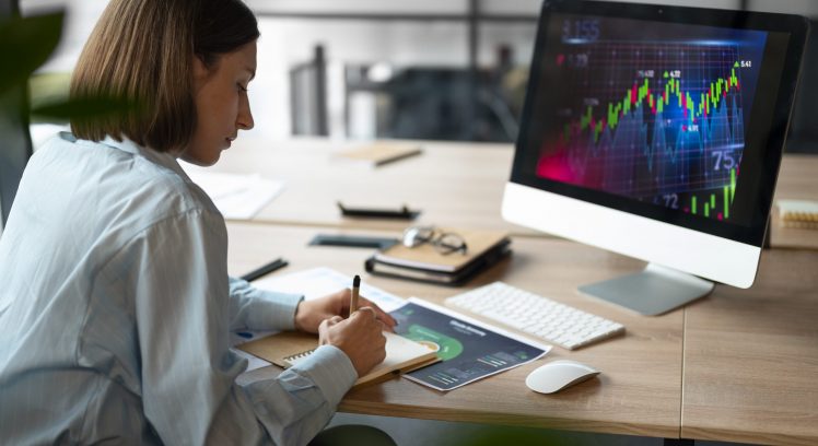 person-office-analyzing-checking-finance-graphs