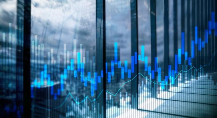 stock-trading-candlestick-chart-diagrams-blurred-office-center-background_161452-11880