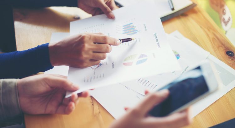 business woman hands pointing holding business graph information diagram.